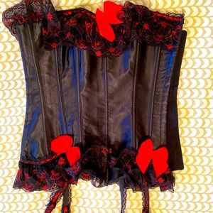 Black Satin bustier red and black lace edging, red bows and garter fasteners